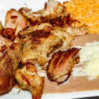 Carnitas · Pork chunks served with Spanish rice, refried beans, jalapenos and Pico de Gallo. Corn or fl...