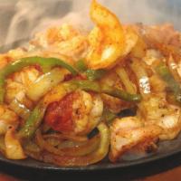 Shrimp Fajitas · Fresh shrimp grilled with onions and bell peppers. Served with Spanish rice, fried beans, so...