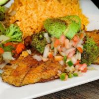 Tilapia Tolteca · Grilled seasoned tilapia fillets topped with sliced avocado and pico de gallo. Served with r...