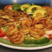California Salad · Bed of lettuce and fresh spinach topped with grilled chicken, grilled shrimp, tomatoes, onio...
