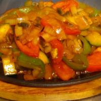 Veggie Fajitas · Grilled zucchini, summer squash, onions, tomatoes, mushrooms and bell peppers served with fr...