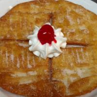 Sopapilla · A fried, crispy flour tortilla rolled in cinnamon sugar, topped with honey, chocolate syrup ...