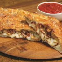 Chicken Classico Calzone · Our handmade dough stuffed with grilled chicken, bacon, onions, and our signature three chee...
