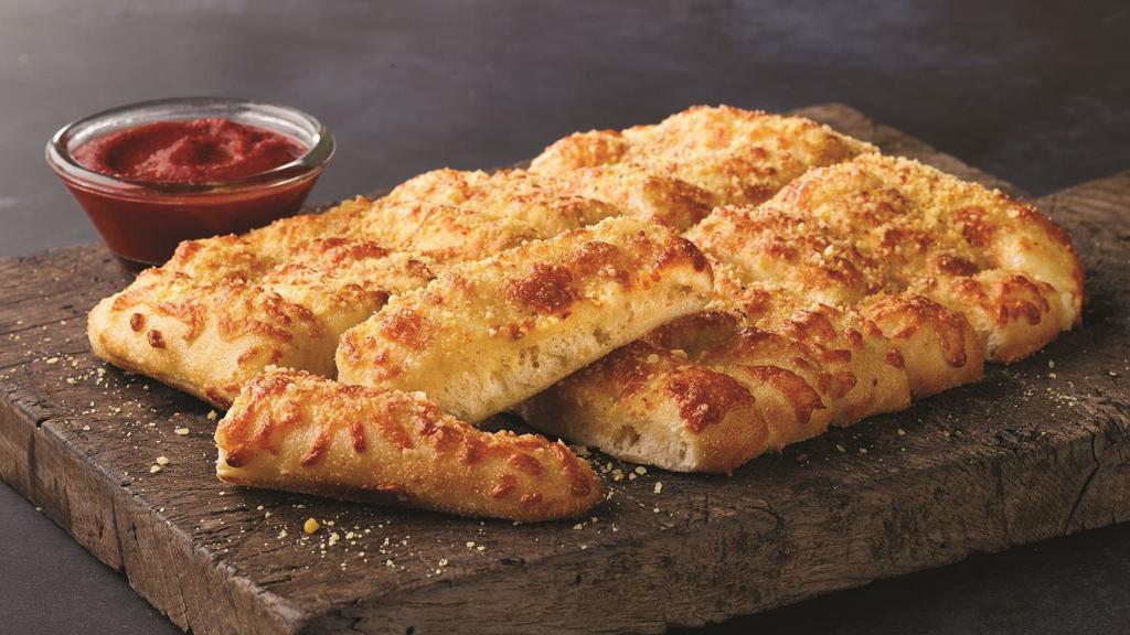 Cheezybread · Fresh-baked bread strips with 4 kinds of cheeses and garlic butter; topped with parmesan and roma seasoning. Served with a side of pizza sauce and ranch dipping sauce.