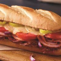 Italiano Sub · Ham, salami, provolone cheese, banana peppers, tomatoes, red onions and sub dressing