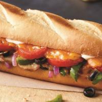 Veggie Sub · Mushrooms, green peppers, onions, black olives, tomatoes, cheddar cheese and sub dressing