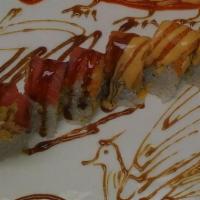 Dragon & Phoenix Roll · Shrimp tempura, chicken tempura, spicy tuna, and salmon, avocado inside, tuna, salmon on top...