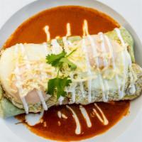 Lunch Brunch Burrito · A spinach flour tortilla stuffed with zucchini, squash, mushrooms and beans sauce, served on...