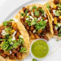 Tacos Al Pastor · 3 street tacos with adobo marinated pork and pineapple chunks. Topped with onion, cilantro, ...