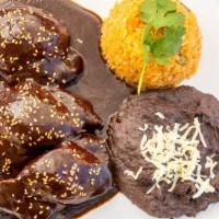 Mole Poblano · Boneless chicken thighs with our homemade mole sauce. This traditional dish from Puebla, Mex...