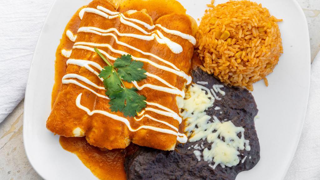 Las Marias · Three shredded chicken or ground beef enchiladas with our adobo red sauce, garnished with sour cream, fresh cheese, refried black beans, and rice.