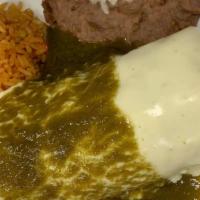 Burrito Al Carbón · Grilled steak cooked with bell peppers and red onions, topped with cheese dip and green pobl...