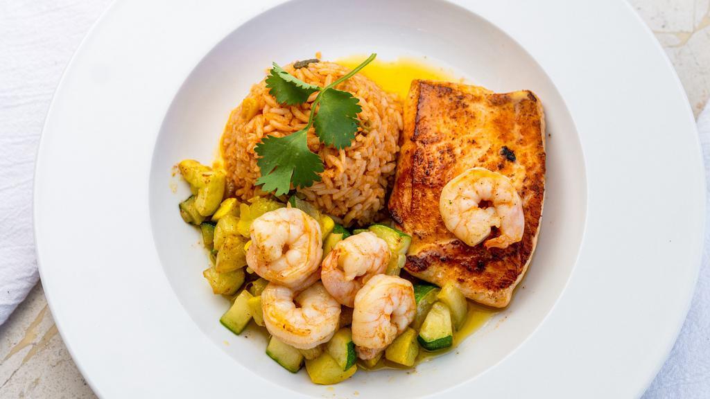 Salmón Al Ajillo · 6 oz. Atlantic salmon fillet cooked with our homemade garlic sauce, shrimp, fresh squash, and zucchini. Served with rice.