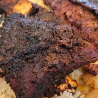 Jerk Beef Rib · Served w/ rice & peas and 2 sides