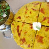 Makki Ki Roti With Sarson Ka Saag · A traditional winter staple. Two maize flour rotis served with mustard greens gravy, topped ...