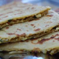 Mixed Veg Paratha · Classic whole wheat Indian flatbread filled with a mix of minced vegetables. Served with rai...