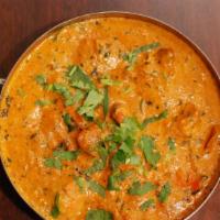 Butter Chicken · Boneless chicken in a sweet, creamy gravy made with tomatoes, onions, and cashews. (gluten-f...
