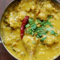 Punjabi Kadhi Pakora · Vegetable fritters (pakoras) cooked in a thick, creamy, yogurt-based gravy. (gluten-free)