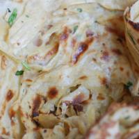 Laccha Paratha · Layered whole wheat flatbread, cooked in a clay oven. Can be made vegan and dairy-free with ...