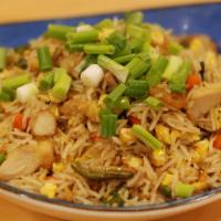 Chicken Fried Rice · Fried rice with chicken, egg, and fresh-vegetables prepared with Indo-chinese spices in a wo...