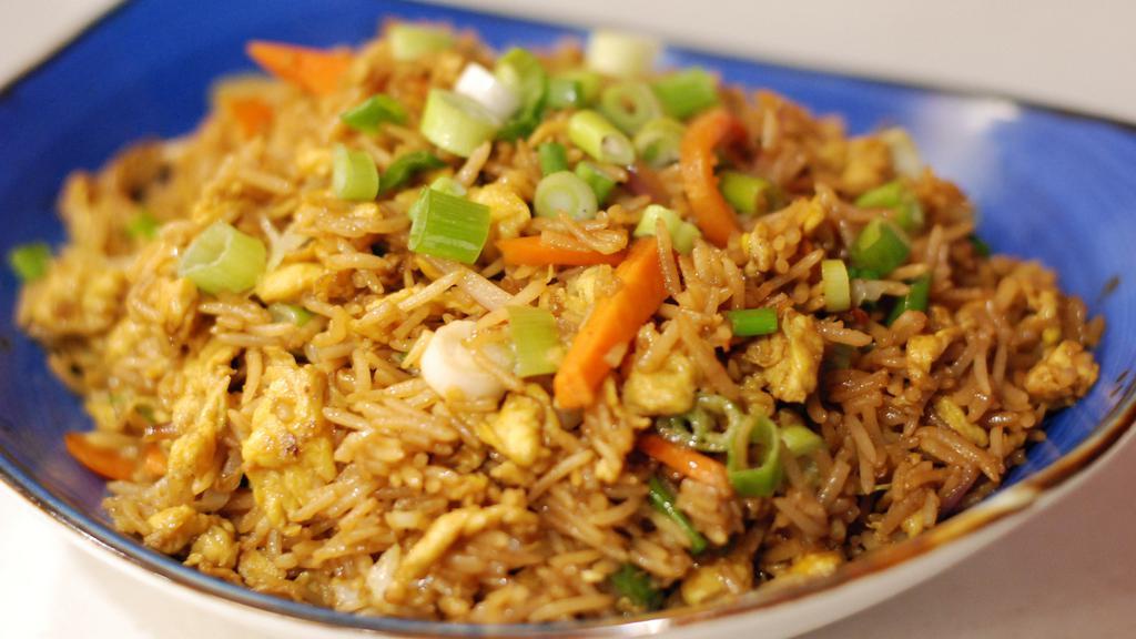 Egg Fried Rice · Fried rice with egg and fresh-vegetables prepared with Indo-chinese spices in a wok. Dairy-free, can be made gluten-free with special request.