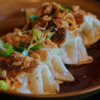 Pan Fried Dumplings (4) (Pork) · Pork, onions and carrots in a dumpling wrapper, grilled on the flat top and garnished with g...
