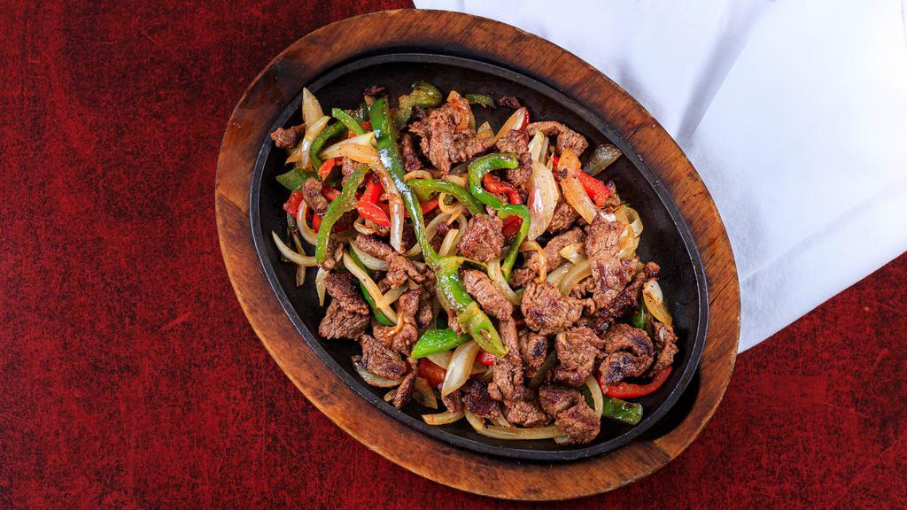 Mango'S Fajitas · This is where the party begins! Everyone loves our fajitas. It's that delicious aroma as they rush the sizzling plate to your table.