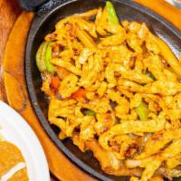 Chicken Fajitas · Prepared with bell peppers, onions, and tomatoes. Served with rice, beans and tortillas