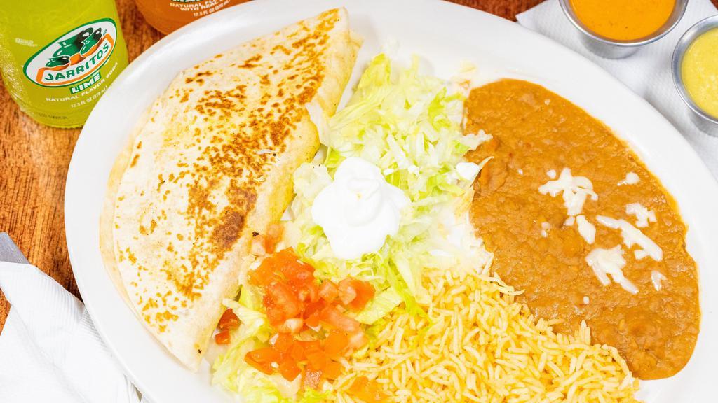 Quesadillas Mexico · Grilled flour tortilla stuffed with cheese. Served with rice, beans and salad.
