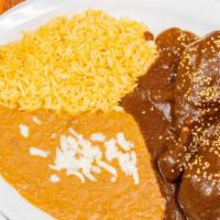 Mole Poblano · Traditional Mexican mole sauce. Served with beans, rice, and tortillas.