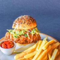 Fried Chicken Sandwich · A burst of savory and spicy flavor in every bite, with sriracha mayo, brussel sprout slaw, c...