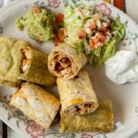 Taquitos (Flautas) · Four rolled fried corn tortillas {two beef two chicken) served with guacamole salad, sour cr...