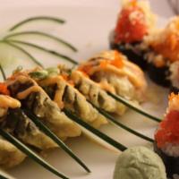 Volcano Roll · Fried. Salmon, tuna, yellowtail, and crab lightly fried and topped with spicy mayo and eel s...