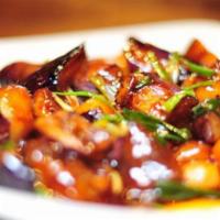 Sautéed Eggplant, Bell Peppers & Potatoes · Vegetarian. Containing no animal meat. Stir-fried potato slices, eggplant, and green bell pe...