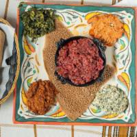 Abyssinia Kitfo (Steak Tartare) · Half pound of ground prime sirloin and tip with a touch of specially blended spiced pure fil...