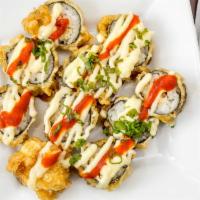 Volcano Roll · With fish and crab deep-fried.