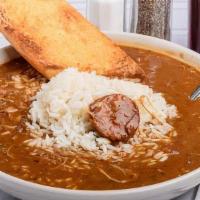 Smoked Sausage Gumbo · Deep brown roux, onions, and celery slow cooked for over four hours and served with smoked s...