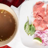 Pho (Beef Noodle Soup) · Hearty oxtail soup with rice noodles, beef tenderloin, and meatballs. Served with bean sprou...