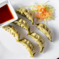 Dumplings · Served steamed or pan-seared with mixed filling.