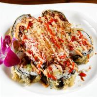 Volcano Roll · Baked California roll topped with scallop, scallions, and masago mixed with spicy mayonnaise...