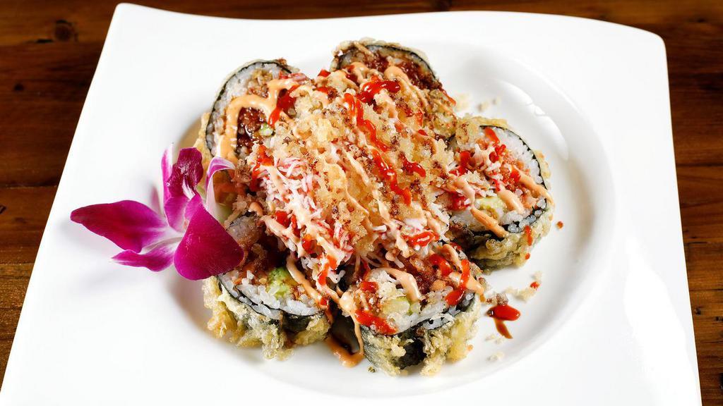 Volcano Roll · Baked California roll topped with scallop, scallions, and masago mixed with spicy mayonnaise mix.