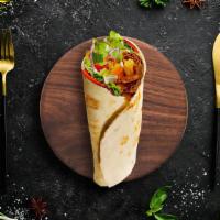 Spicy Lamb Tikka Wrap · The classic char-grilled bone-in lamb wrapped in a flatbread with our fresh salad and with a...