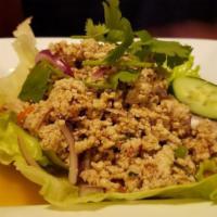 Larb Gai Salad · Minced chicken, chili powder, roasted rice powder, onion, and cilantro with Thai chili-lime ...