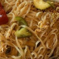 Pad Thai · Thin rice noodles stir fry with egg, beansprouts and spring onions. Alongside with crushed p...