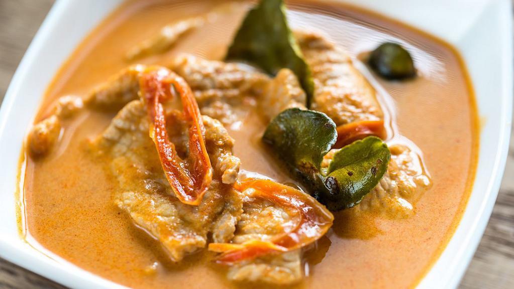 Panang Curry · Mild. A delicately spiced curry in a rich coconut milk, peanut butter, bell peppers & green beans.
