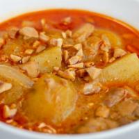 Mas Sa Mun Curry · Southern Thailand dish with coconut milk, potatoes, sweet potatoes, carrots and onions, topp...