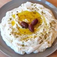 Labenh · YOGURT CHEESE  SPREAD GARNISHED WITH OLIVE OIL. SERVED WITH PITA BREAD.