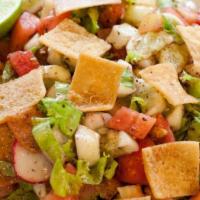 Fattoush · DICED TOMATOES, MIXED GREENS, CUCUMBERS, RED ONIONS, CRACK TOASTED PITA BREAD, WITH LEMON JU...