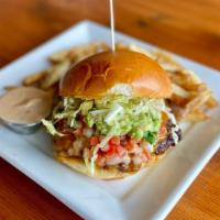 South Of The Border Burger · house-ground beef, cheddar, American, queso dip, pico de gallo, charred salsa, chipotle mayo...