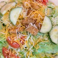House Salad · Crisp salad greens topped with sliced cucumbers, tomatoes, & croutons.